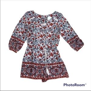 En Creme long sleeve front button romper